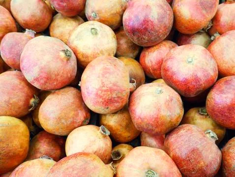 Pomegranate in the store close up for background Stock Photos