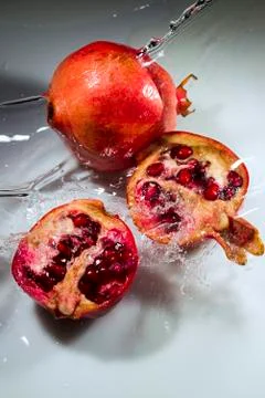 Pomegranate on a white background Stock Photos