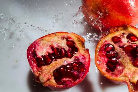 Pomegranate on a white background Stock Photos
