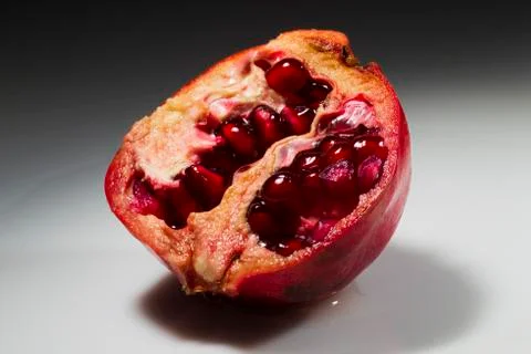 Pomegranate on a white background Stock Photos