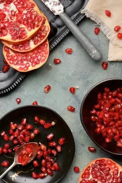 Pomegranates on a table Stock Photos