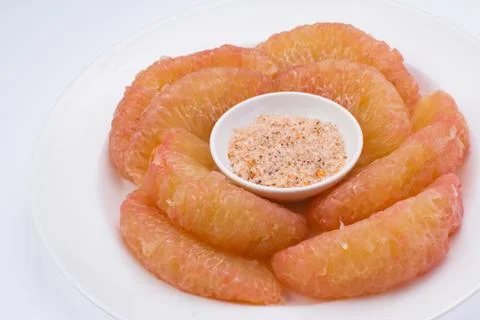 Pomelo in dish Stock Photos