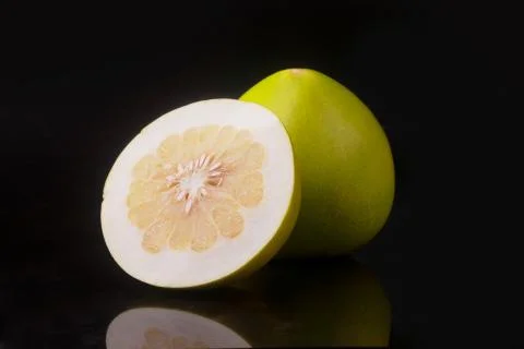 Pomelo fruit on black Stock Photos