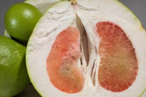 Pomelo. grapefruit slices with fresh red, negative space Stock Photos