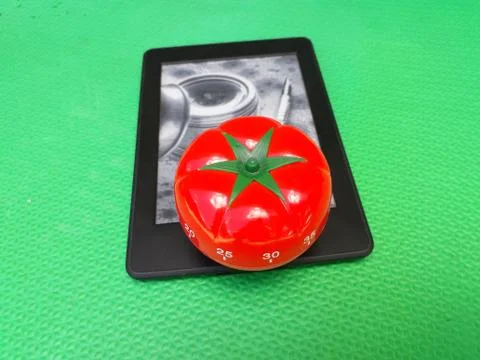 Pomodoro Timer - mechanical tomato shaped kitchen timer for cooking, studying Stock Photos