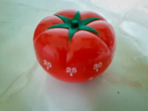 Pomodoro Timer in old paper texture at center. Foto stock