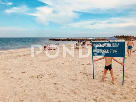Pomorie, Bulgaria - June 05, 2018: View of the people spending time on the be Stock Photos