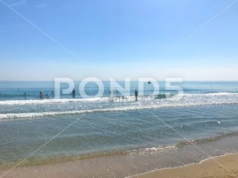 Pomorie, Bulgaria - June 05, 2019: People Relaxing On The Beach. Stock Photos