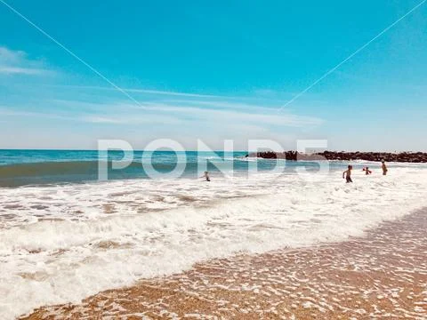 Pomorie, Bulgaria - May 30, 2018: View of the people spending time on the bea Stock Photos
