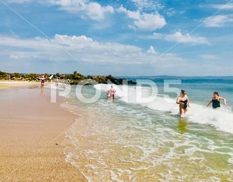 Pomorie, Bulgaria - May 30, 2018: View of the people spending time on the bea Stock Photos