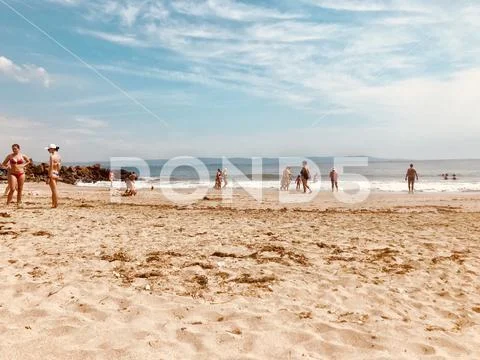 Pomorie, Bulgaria - May 30, 2018: View of the people spending time on the bea Stock Photos
