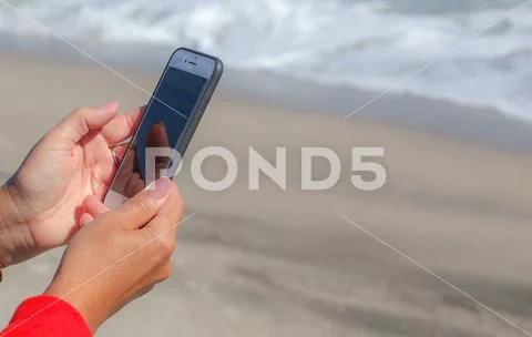 Pomorie, Bulgaria - October 06, 2018: Photo of a woman using smart phone. Stock Photos