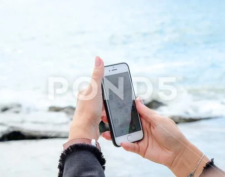 Pomorie, Bulgaria - October 06, 2018: Photo of a woman using smart phone. Stock Photos