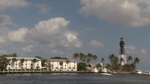 Pompano Beach Lighthouse Frame Right Afternoon with Boat Passing Stock Footage 76757423