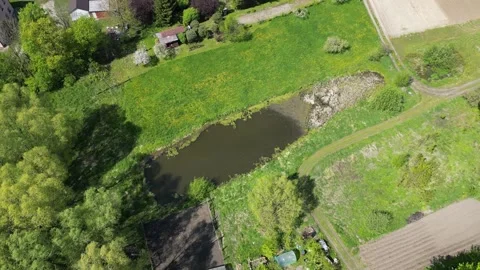 Pond and fields in Boreczno Stock Footage 307680494
