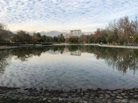 Pond and reflection of clouds at a park in Santiago, Chile Fotos Stock