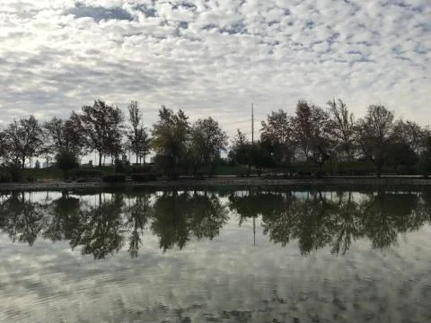 Pond and reflection of clouds at a park in Santiago, Chile Stock Photos