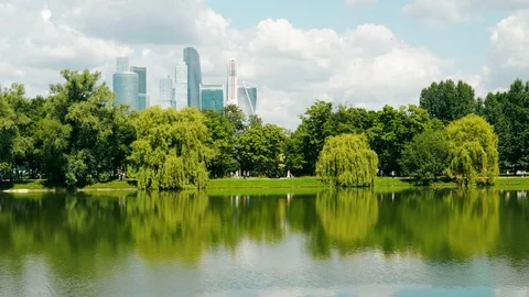 A pond on the background of city skyscrapers Stock Footage 80244194