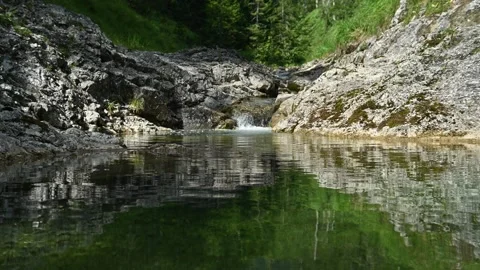 A pond of a beautiful mountain stream in summer Stock-Footage 260838149