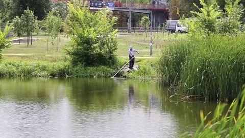 Pond cleaning Stock Footage 78029405