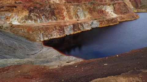 Pond with contaminated waters of an old copper mine. environmental hazard Stock Footage 154406679