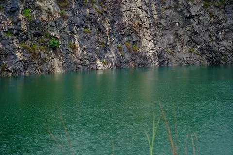 Pond formed in a given up quarry Stock Photos