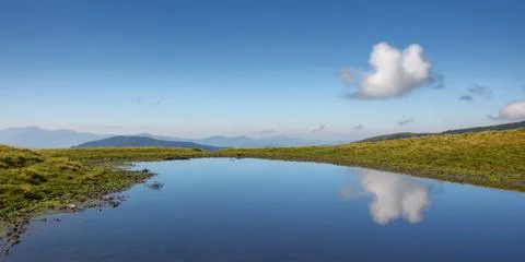 Pond in mountains Stock Photos