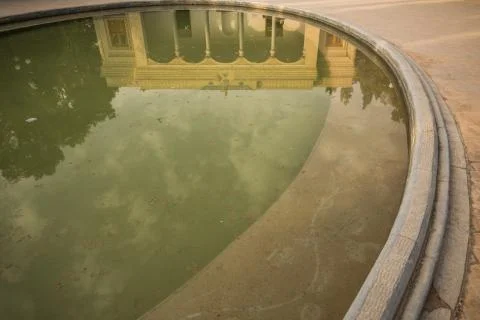 Pond reflecting an old mosque Stock Photos