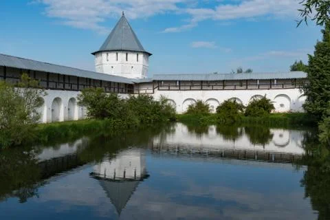 Pond with reflection of tower and wall  in Spaso-Prilutsky Monastery in Volog Stock Photos