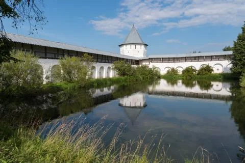 Pond with reflection of tower and wall  in Spaso-Prilutsky Monastery in Volog Stock Photos
