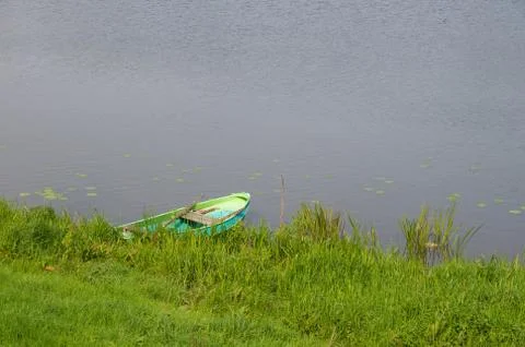Pond with rowing boat Stock Photos