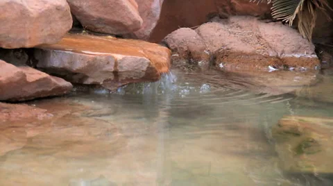 Pond small rock waterfall Stockbeeldmateriaal 6530244