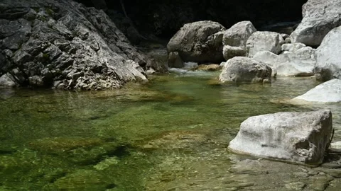 Pond of a stony mountain stream with clean water 스톡 동영상 260833358