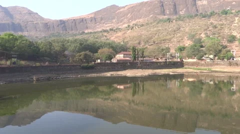 A pond Surround by Hills Stock Footage 50153946