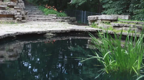 A Pond Surrounded by Stone Stock Footage 25329418