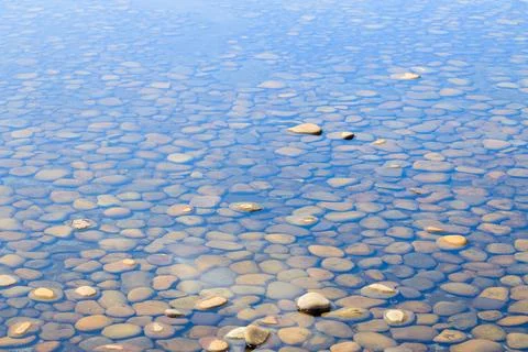 Pond water pool design perspective ground surface with stones background tran Stock Photos