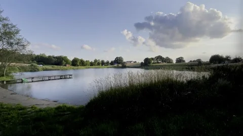 Pond with a waterslide Stock Footage 269023877