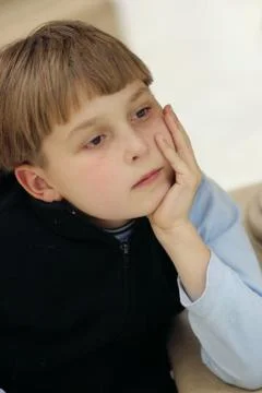 Pondering boy Stock Photos