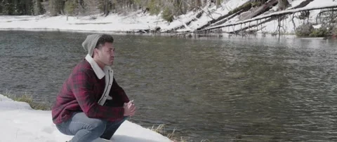 Pondering by Mountain River Video stock 243761763