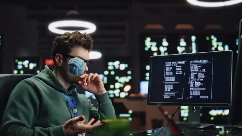 Pondering software developer working computer at server room closeup. IT worker Stock Footage 260253935