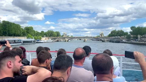 Pont Alexandre III bridge seen from a Bateau Mouche tour boat cruising in Paris Stock Footage 204090836