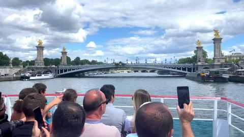 Pont Alexandre III bridge seen from a Bateau Mouche tour boat cruising in Paris Stock Footage 204090845