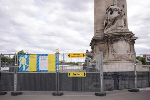 Pont Alexandre III column with statues and fences Paris France May 2025 Stock Photos