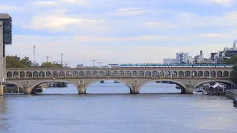 Pont de Bercy bridge with a metro passing on the river Seine in Paris, France Stock Footage 165271692