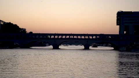 Pont de Bercy bridge at sundown crossing the River Seine in Paris France, Stock Footage 245825807