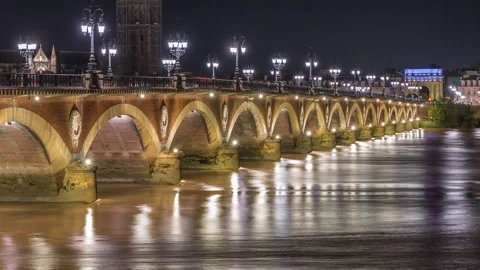 Pont de Pierre stone bridge with Porte de Bourgogne night timelapse in Bordeaux Stock Footage 311784349