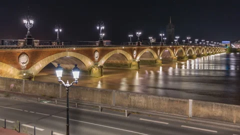 Pont de Pierre stone bridge with Porte de Bourgogne night timelapse in Bordeaux Stock Footage 311784481