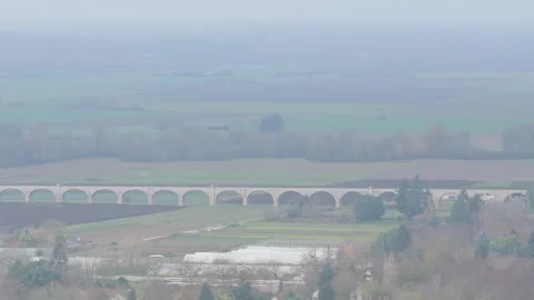 The Pont du Chemin de Fer railway bridge spanning across the countryside and Stock Footage 346704424
