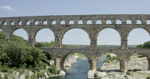 Pont du Gard drone ging from down to up discovering the bridge occitanie Stock Footage 132796975