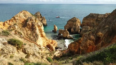 Ponta da Piedade golden cliffs and sea stacks, Lagos Algarve Portugal Video stock 346658447